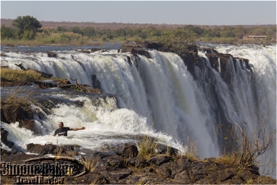 Guide demonstrating where I would sit in the edge of the falls