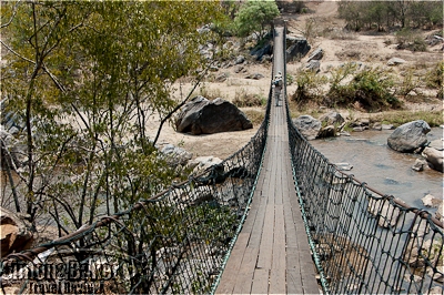 The lodge was reached via a suspension footbridge over the Mkulumadzi River