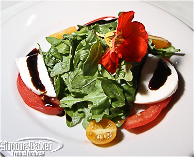 Arugala salad garnished with a flower