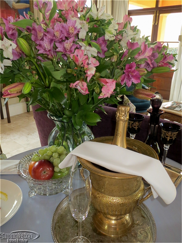 Sparkling wine and flowers on arrival