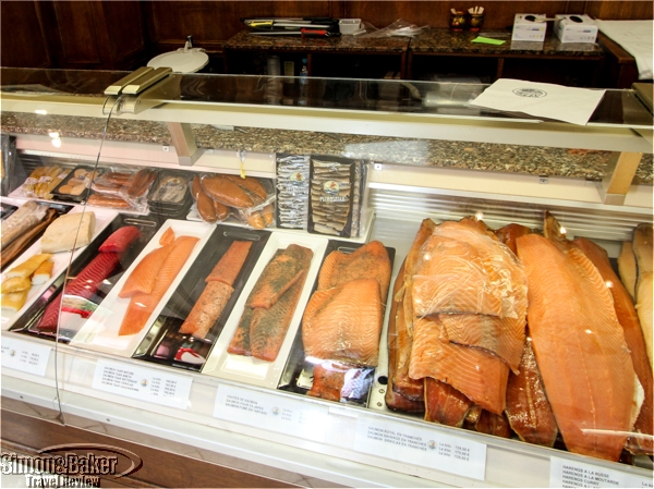 Several varieties of salmon, some with special marinades like beet root
